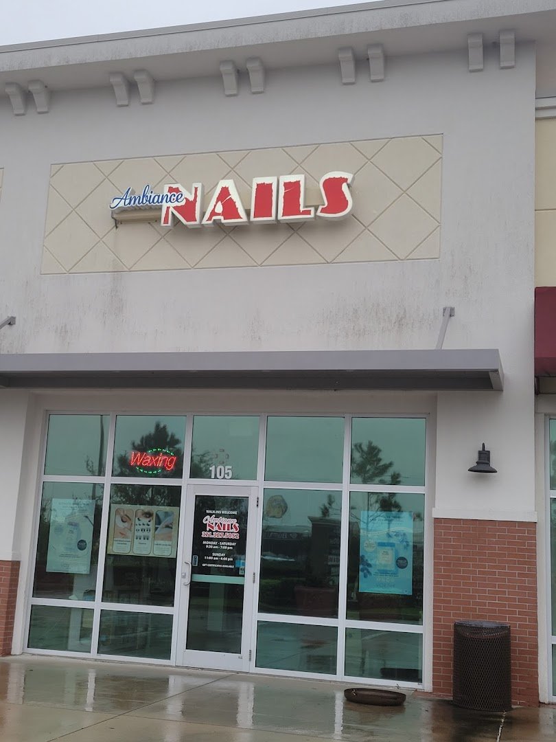 A nail technician shapes a fresh set.