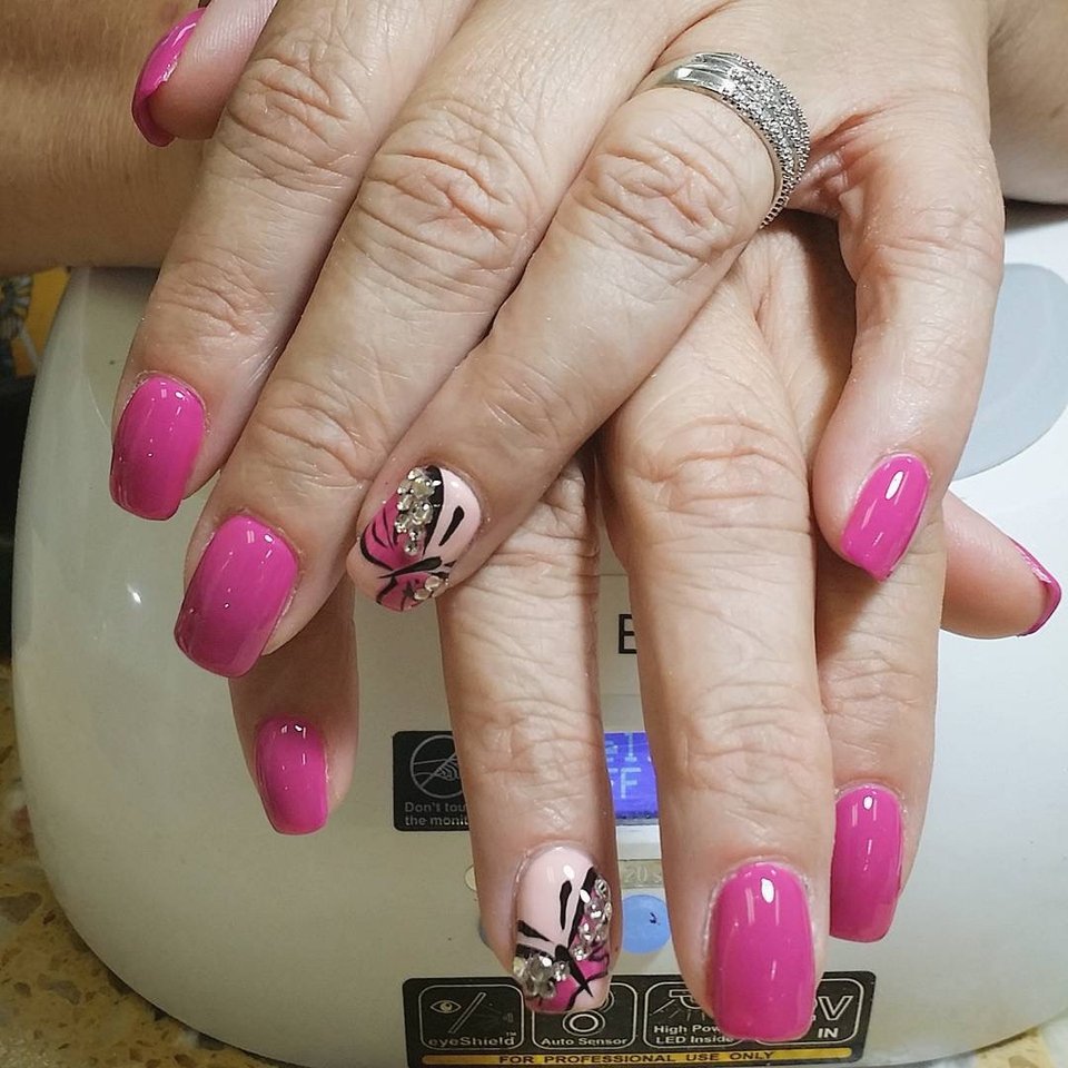 Manicured nails with glossy polish.